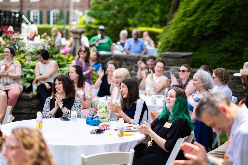 Staff members cheer on recognized colleagues