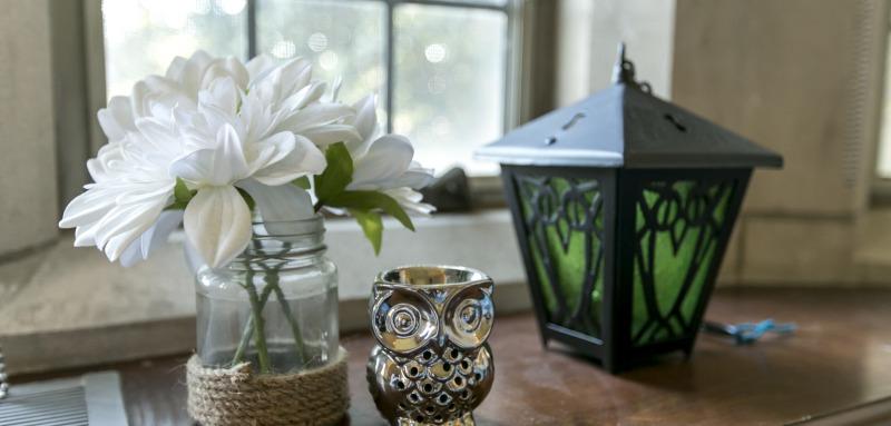 Dorm Decor including a lantern, owl, and flowers