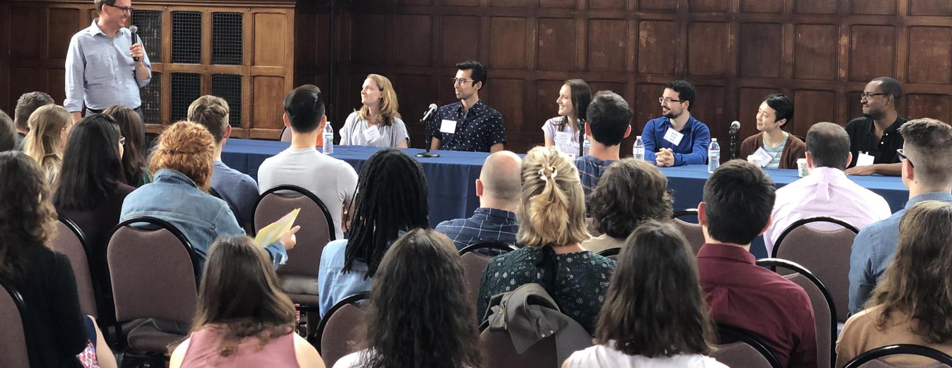 Program Director Glenn Cummings leads a panel of previous students at the Postbac orientation.